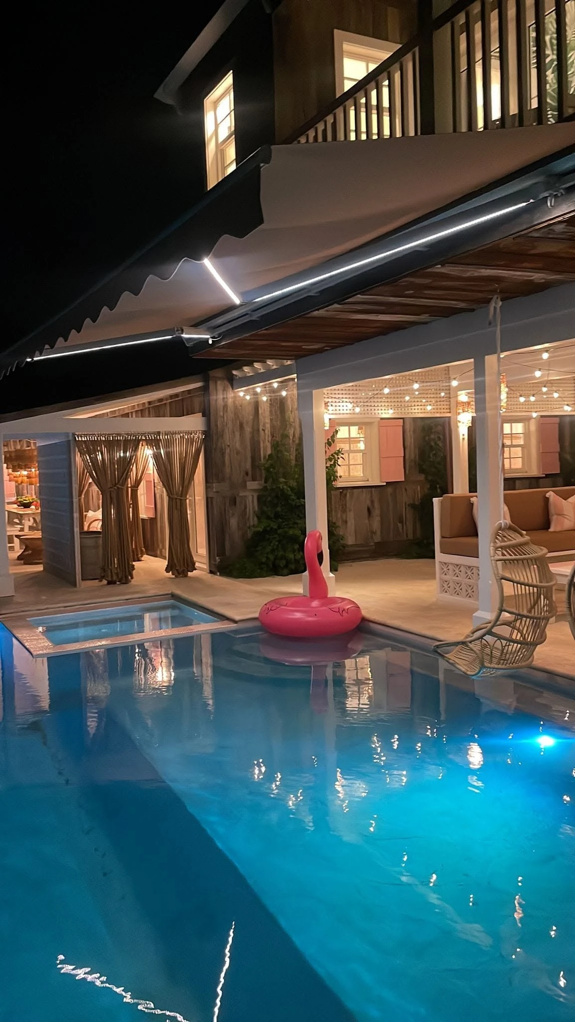 Retractable awning over a poolside terrace